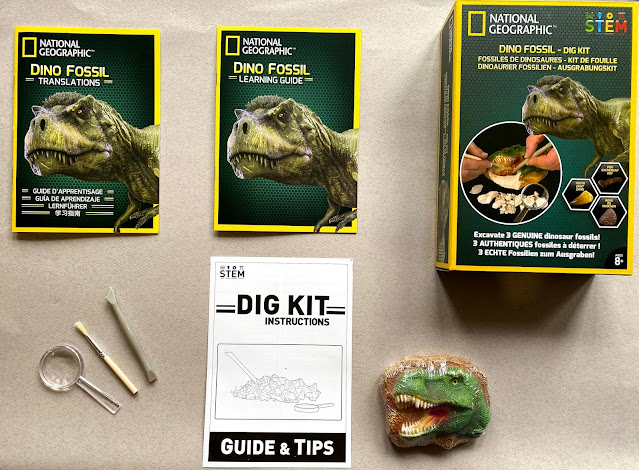 Contents of the Dino Fossil Dig Kit from the National Geographic range by Bandai UK includes a block contain 3 dinosaur fossils, a magnifying glass, small brush, digging tool, instructions, learning guide and translation booklet