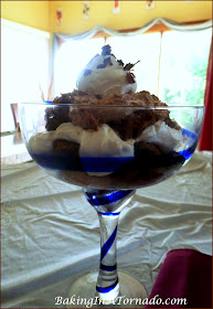 Biscotti Tiramisu Trifle, coffee soaked biscotti, spiked filling and flavored whipped cream come together to create this decadent dessert | Recipe developed by www.BakingInATornado.com | #recipe #dessert 