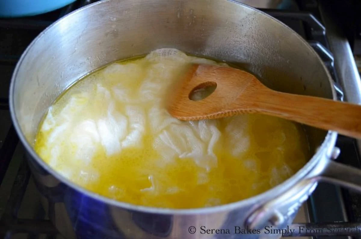 Cheesecloth being soaked in butter, wine and chicken stock.