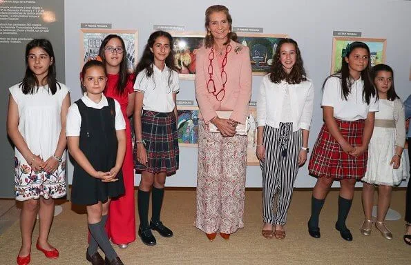 Infanta Elena of Spain wore Boss pumps and Mango pink jacket and Zara print trousers carried Mango clutch