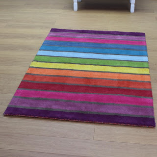 http://www.landofrugs.com/rugs/rainbow-striped-multi-colour-rug.html