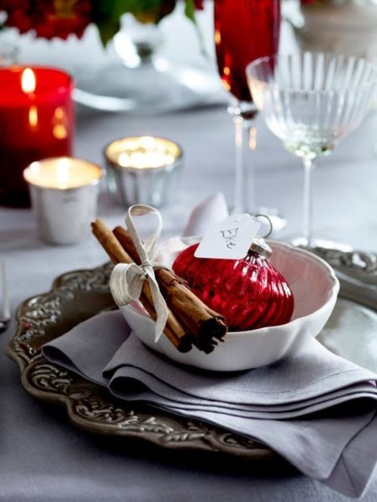 red and white Christmas table decor with cinnamon