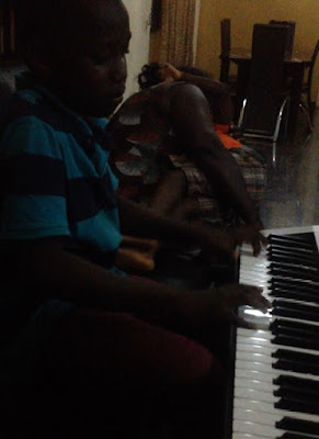 young pianist playing using solfa notation