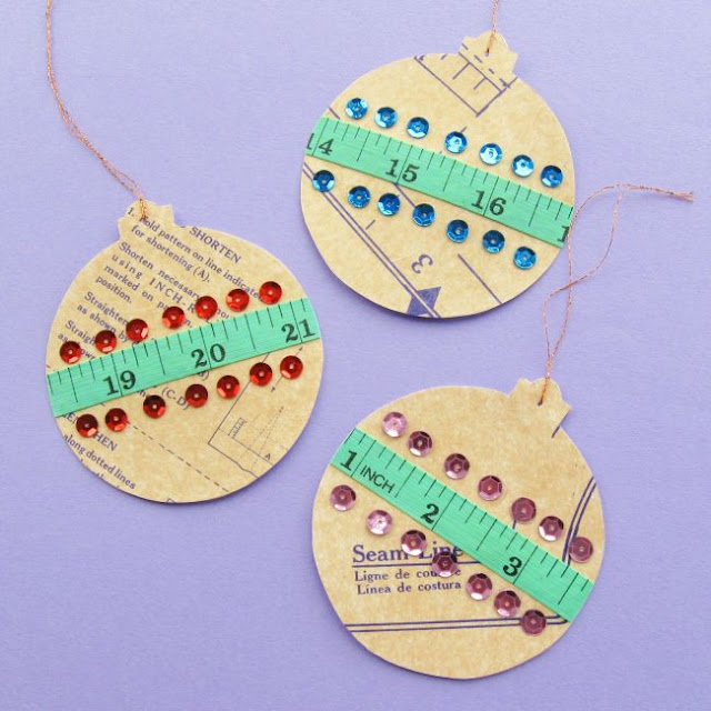 Crafty Christmas Bauble Tutorial: Make a Sewing-Themed Ornament for Your Tree! DIY Paper Christmas Baubles Decorated with an old Sewing Pattern