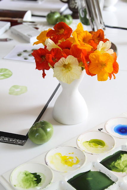 studio, artist studio, watercolor painting, tomatoes, nasturtiums, paint palette, Anne Butera, My Giant Strawberry