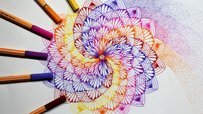 This is the image of a twisted mandala with stippling on one side and on the other side a number of stabilo fine point pens