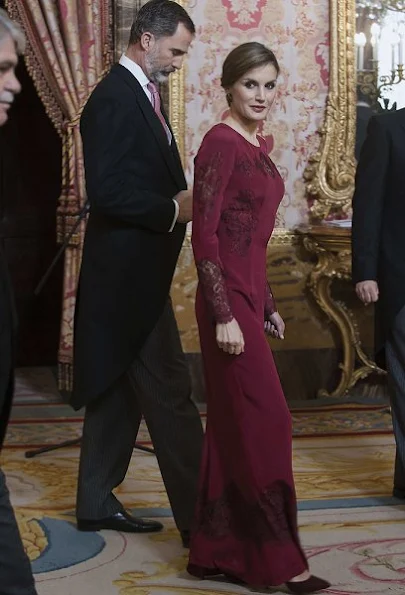 Queen Letizia attends the annual Foreign Ambassadors reception at the Royal Palace. Queen Letizia wore Felipe Varela Long sleeve dress in red diamond earrings