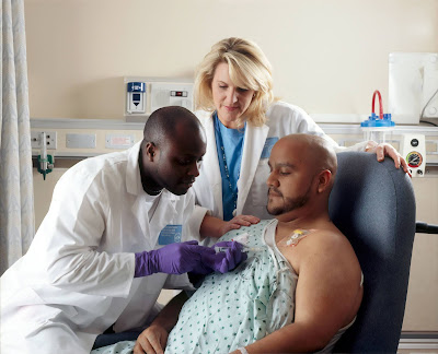 doctor giving patient chemotherapy