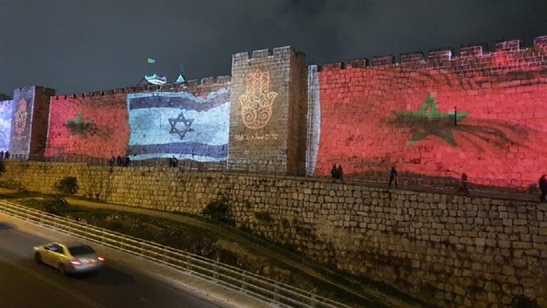 Huge flags of Morocco on the walls of Jerusalem alongside the Israeli flag