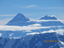 Mt. Everest (left) massif on morning flyby, from Kathmandu Valley, Nepal