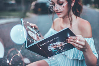 Woman with glasses reading a book