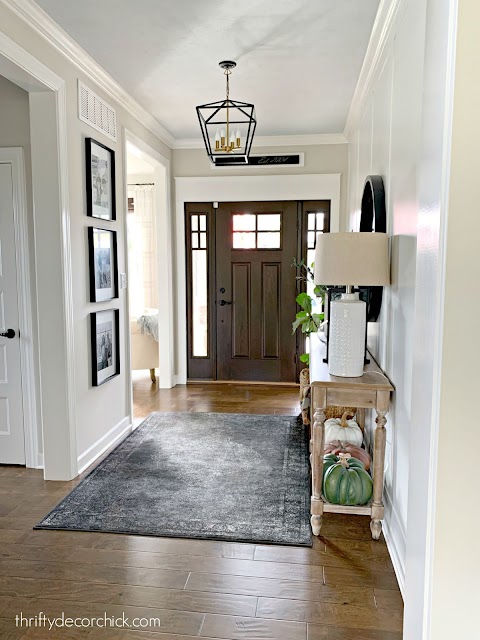 foyer with light walls blue ceiling