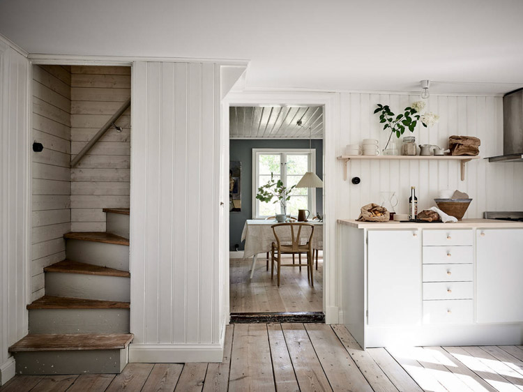 An Idyllic Blue and White Swedish Cottage In The Countryside