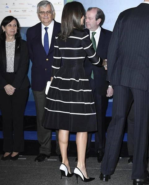 Queen Letizia wore a new flare striped cocktail dress by Carolina Herrera