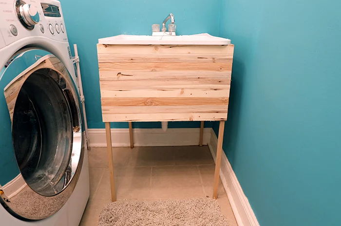 finished laundry utility tub sink wood lath cover