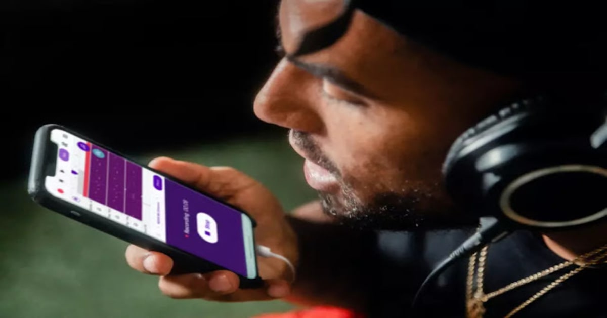 a person recording his voice on a phone a person recording his voice on a phone