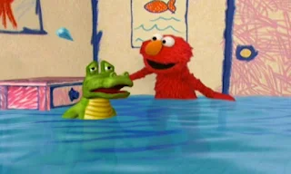 a crocodile is crying and Elmo asks how many tears coming out of its eyes. Elmo's World Eyes Elmo's Question