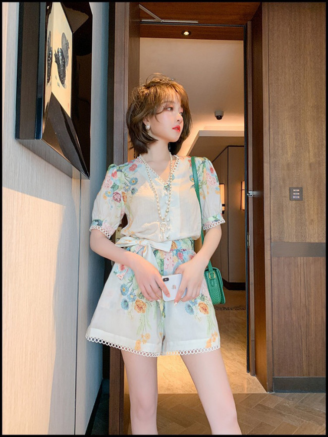 Jumsuit họa tiết hoa cột eo