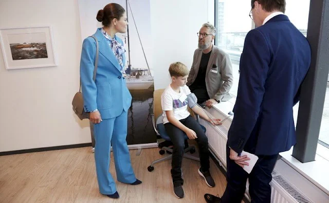 Crown Princess Victoria wore a new royal blue suit. The Princess wore a rose-garden print blouse by Camilla Thulin