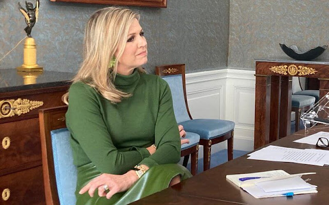 Queen Maxima wore a green cashmere sweater and green leather skirt. Bodes and Bode green earrings