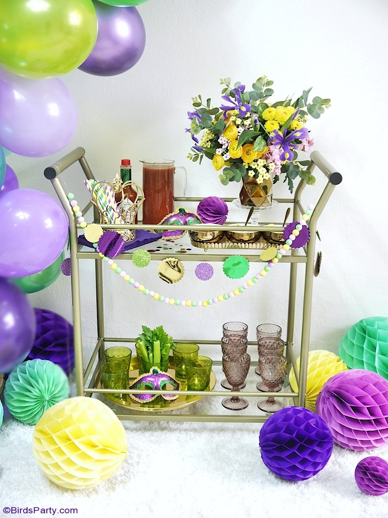 Mardi Gras Bar Cart Styling Ideas + Cajun Bloody Mary Recipe - easy DIY crafts and decor ideas + a delicious cocktail to serve at a Mardi Gras party! by BirdsParty.com @birdsparty #cocktail #cocktailrecipe #recipe #drinksrecipe #mardigras #barcart #barcartstyling #diymardigradecorations #mardigrasdecorations #mardigrasrecipes #bloodymary #bloodymarycocktail #bloodymaryrecipe #cajunbloodymary