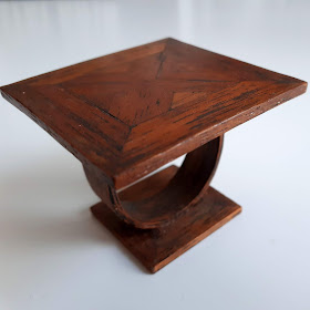 1/12 scale miniature oak coffee table with inlaid top and curved botttom.