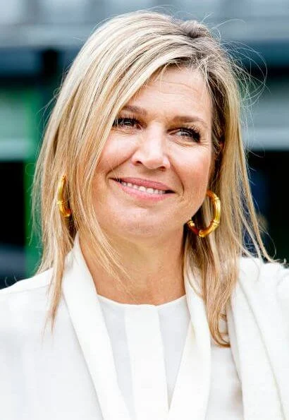 Queen Maxima wore Massimo Dutti ivory silk blouse with bow and trousers, Cartier Gold Bamboo earrings