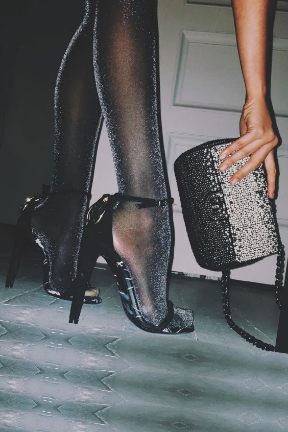 Gray tights, black sandals and purse
