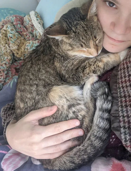 Young woman adopted an older kitty who had been returned to the shelter a few times