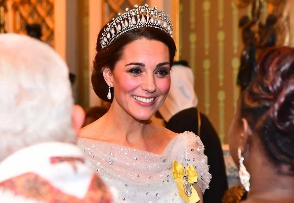 The Duchess of Cambridge wearing Lover's Knot tiara with a pale blue, fitted bespoke Jenny Packham gown