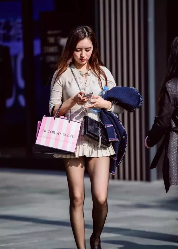 Short black skirt and black tights