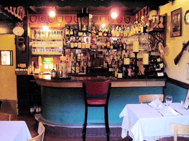 One stool provides the perfect spot for a quick drink at the Old New York establishment Chez Napoleon