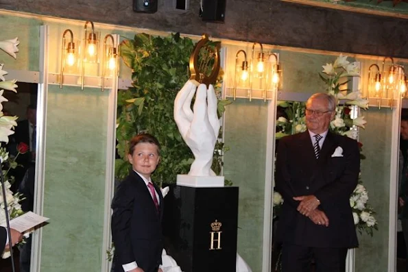 Queen Margrethe, Crown Prince Frederik with his children Prince Christian and Princess Isabella, Prince Joachim, his son Prince Felix and Princess Marie at unveiling of sculpture at Royal Theatre