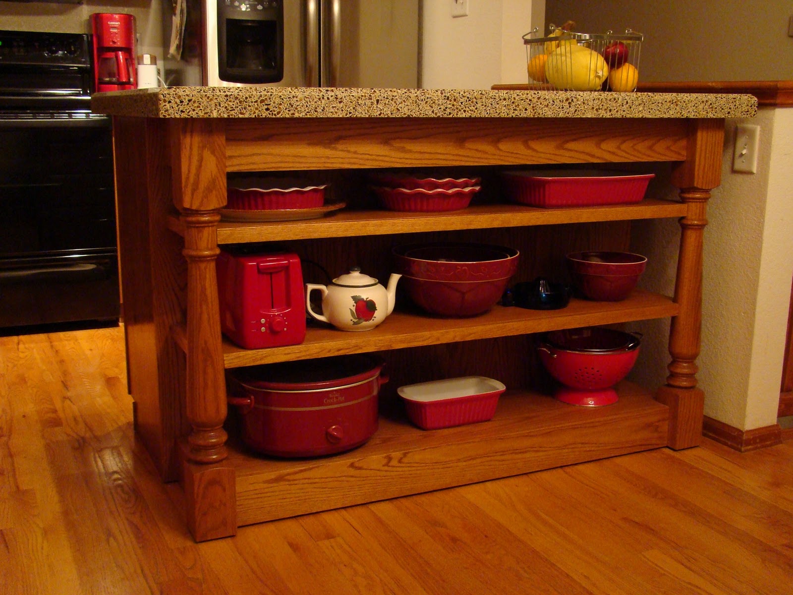Kitchen cabinet rollouts and door pulls throughout the kitchen and on the island as well