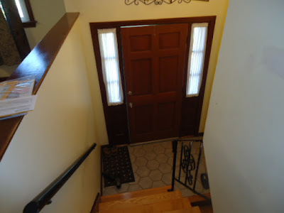 stained interior front door before painting white.