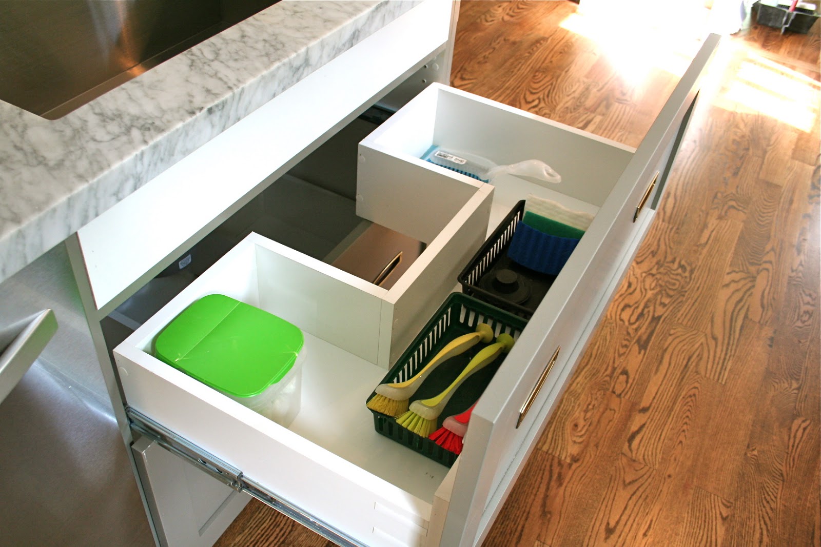 drawer in front of kitchen sink