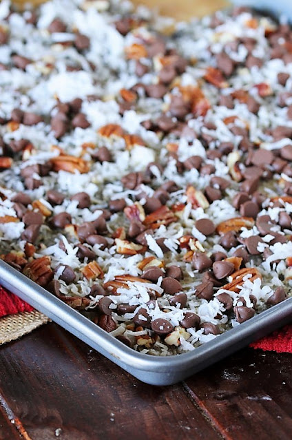 Topping German Chocolate Cracker Candy with Pecans, Chocolate Chips, and Coconut Image