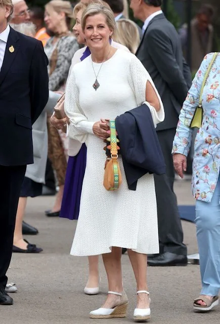 The Countess of Wessex wore a new blouson sleeve knit midi dress from Victoria Beckham. Princess Anne and Princess Alexandra