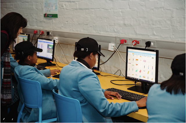 A photo of students going through the Africa Code Week program