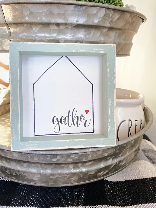 gather sign in a tiered tray