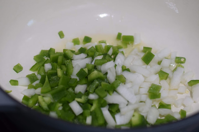 Diced bell pepper and onion in the pot. 