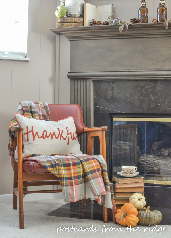 pillow and plaid blanket scarf mid century wooden arm chair