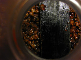 The aging beer with currants and oak floating.