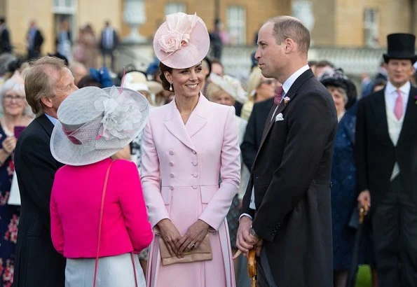 Kate Middleton wore a bespoke soft pink coatdress by Alexander McQueen. Loeffler Randall clutch. Countess of Wessex