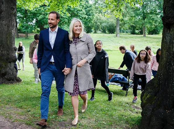 Princess Mette Marit and Prince Haakon and visits the Summer Library at the Palace Park. Princess Mette Marit wore Valentino dress