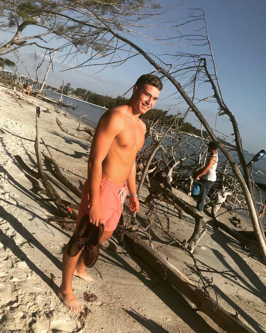 hot-guy-sand-beach-summer-smiling-fit-shirtless-body