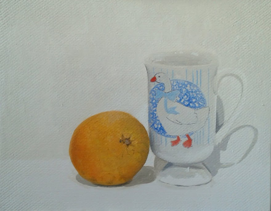 Naranja y taza