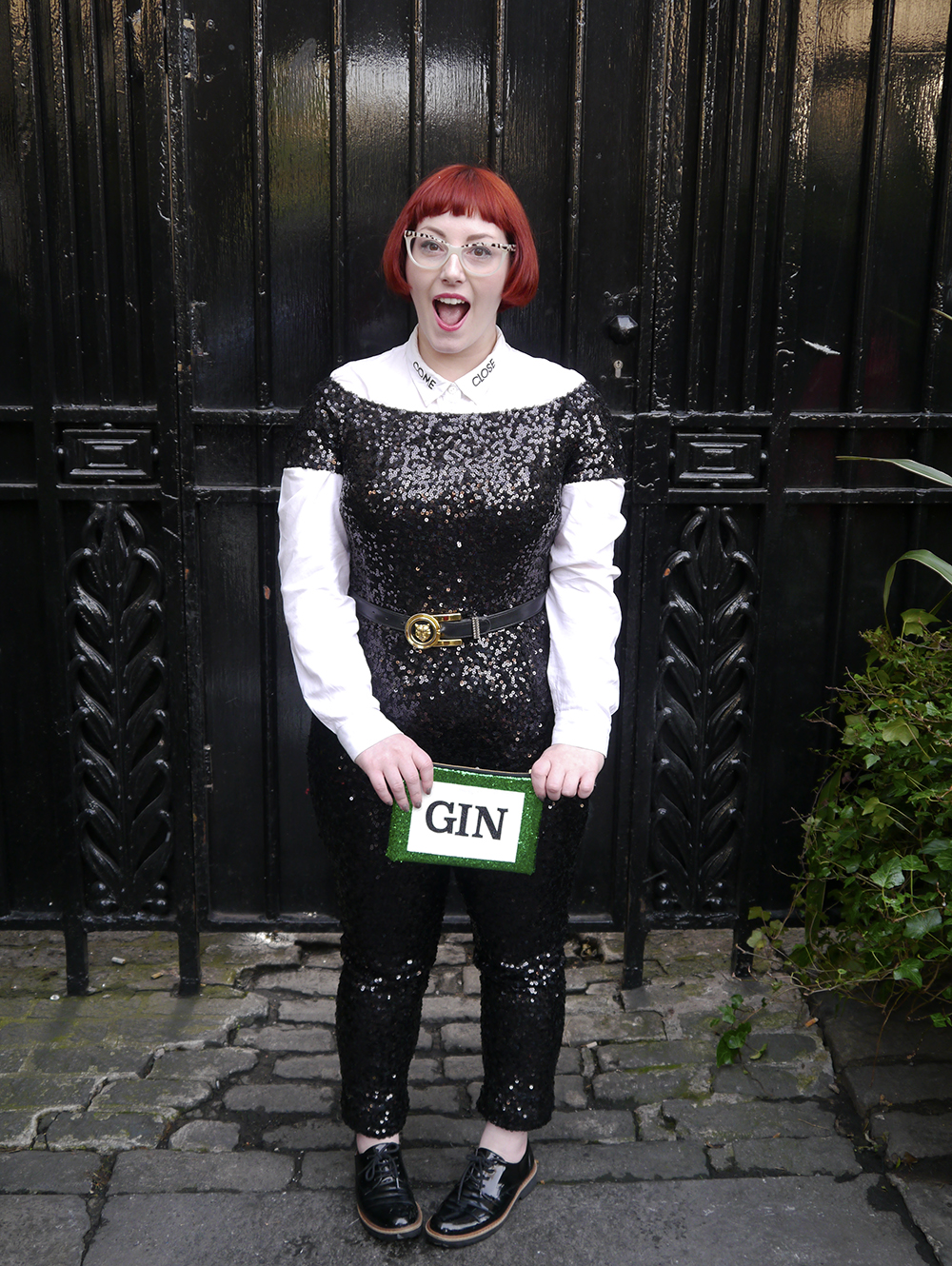Gin O'clock with SoS15's glitter clutch bag styled by, styled by helen, Christmas party outfit, party outfit, sequined outfit, sequined jumpsuit, glitter clutch bag, party clutch bag, SoS15, gin bag, gin clutch bag, festive party outfit inspiration, black sequined jumpsuit, catsuit, faux tuxedo style, scottish blogger, fashion blogger style, Edinburgh blogger, red head, Spex Pistol glasses, statement glasess, shop small, London designer, UK designer, independent designer UK, statement bag