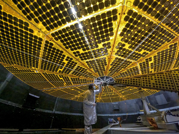 A technician inspects one of the twin solar panels for NASA's Lucy spacecraft at the Lockheed Martin facility in Denver, Colorado...in January of this year. A technician inspects one of the twin solar panels for NASA's Lucy spacecraft at the Lockheed Martin facility in Denver, Colorado...in January of this year.