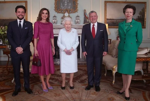 Queen Elizabeth II, Princess Anne, Crown Prince Al Hussein. Queen Rania is wearing a pink Givenchy dress